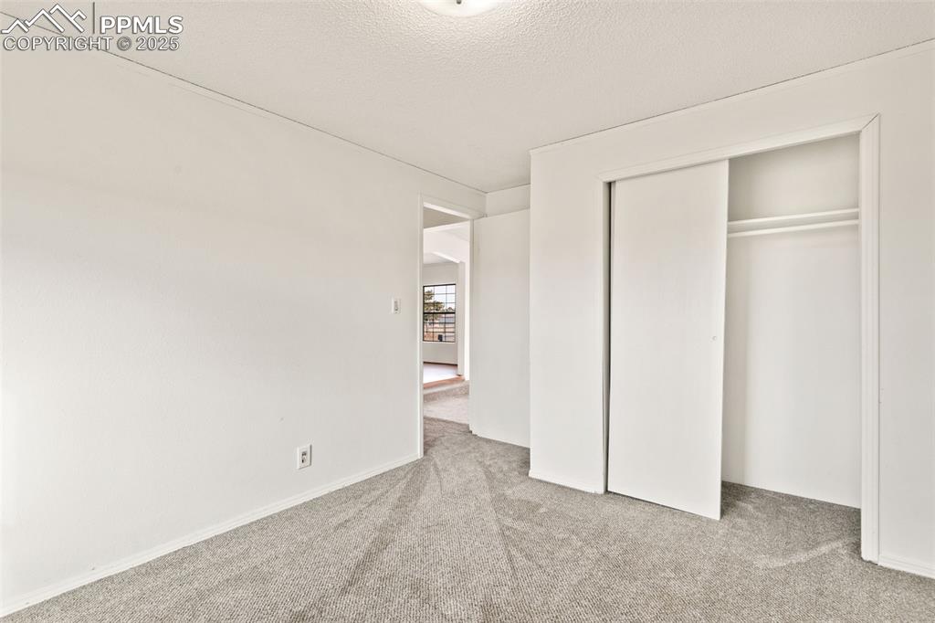 5915 West Condor Road Peyton, CO 80831 - Photo 29 of 50 secondary bedroom on main level with new carpet