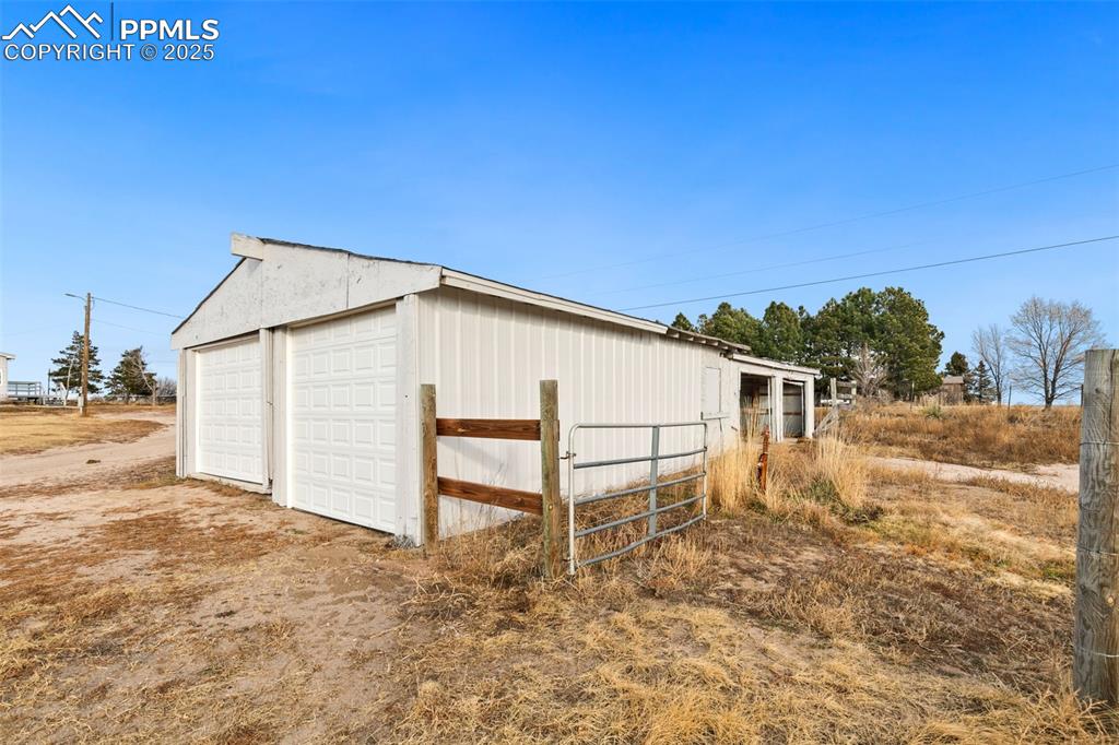 5915 West Condor Road Peyton, CO 80831 - Photo 4 of 50 Fantastic detached garage with stalls for animals as well