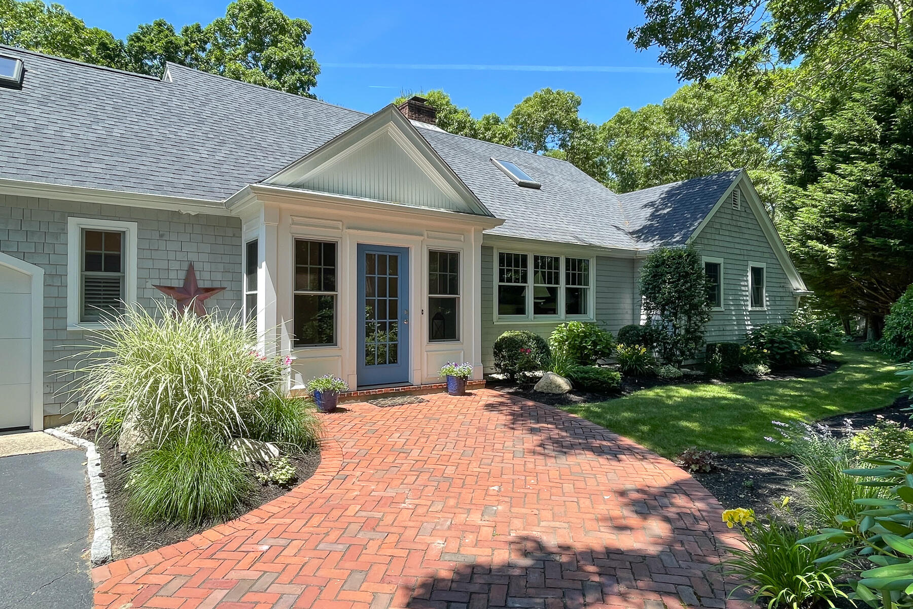 a front view of a house with a yard