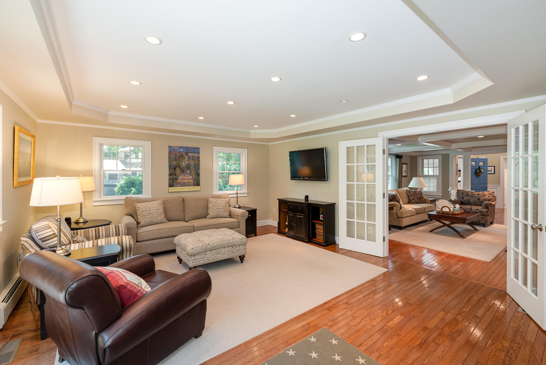 106 Scraggy Neck Road Cataumet, MA 02534 - Photo 17 of 43 a living room with furniture and a flat screen tv