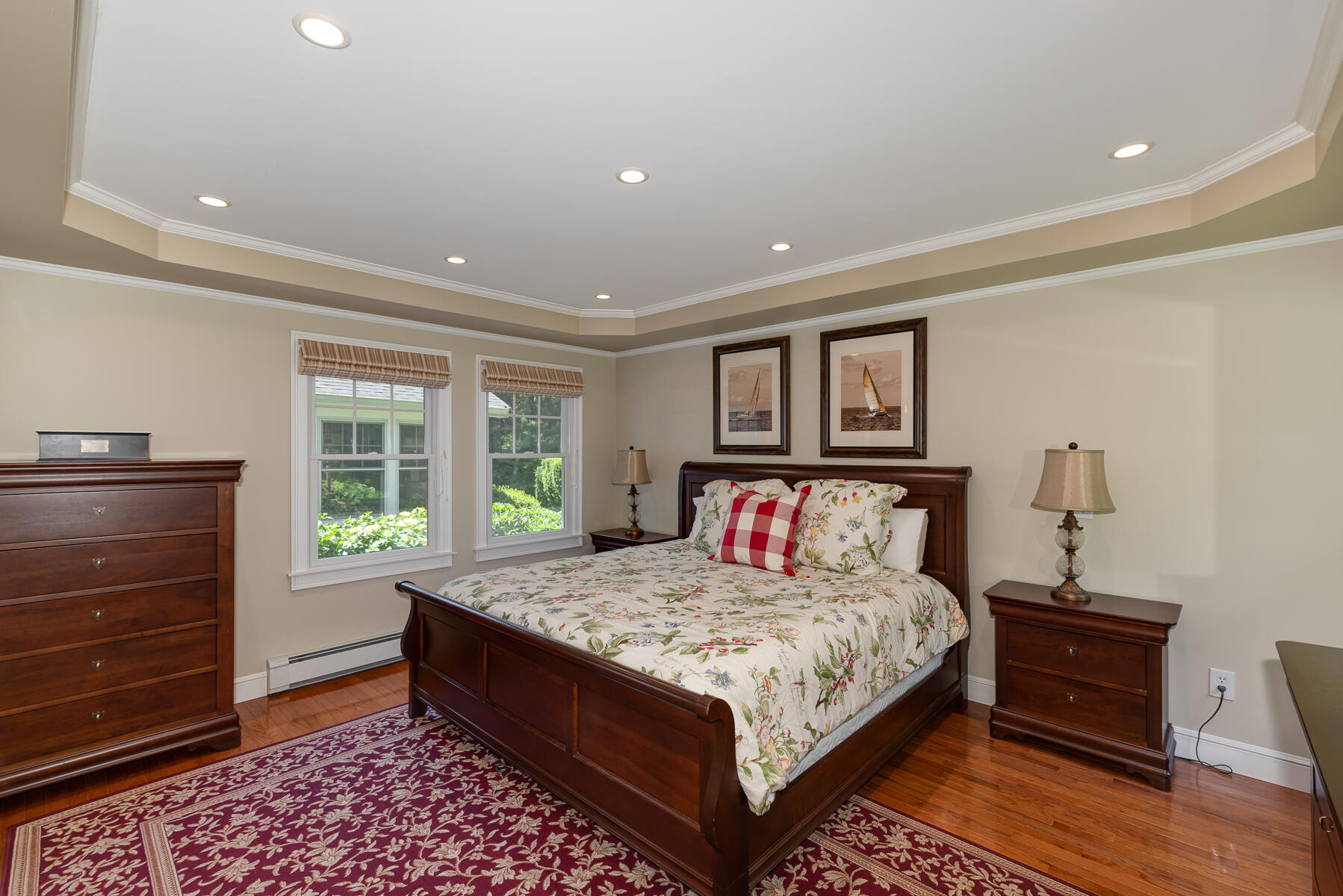 106 Scraggy Neck Road Cataumet, MA 02534 - Photo 19 of 43 a bedroom with a bed and a dresser