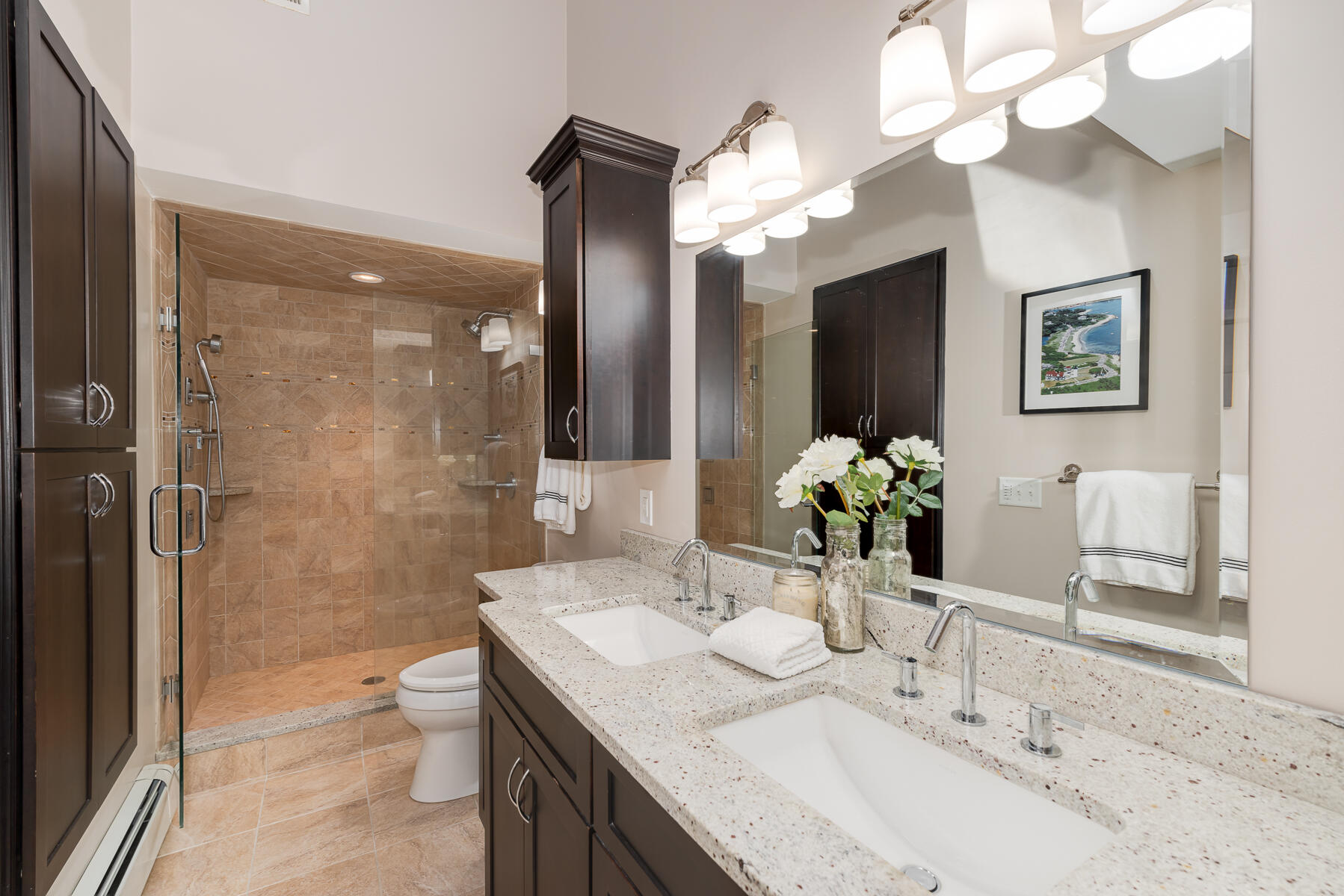 106 Scraggy Neck Road Cataumet, MA 02534 - Photo 20 of 43 a bathroom with a granite countertop sink a large mirror and a shower