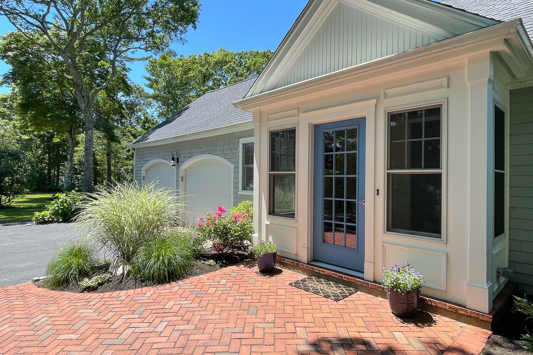 106 Scraggy Neck Road Cataumet, MA 02534 - Photo 2 of 43 a front view of a house with a yard