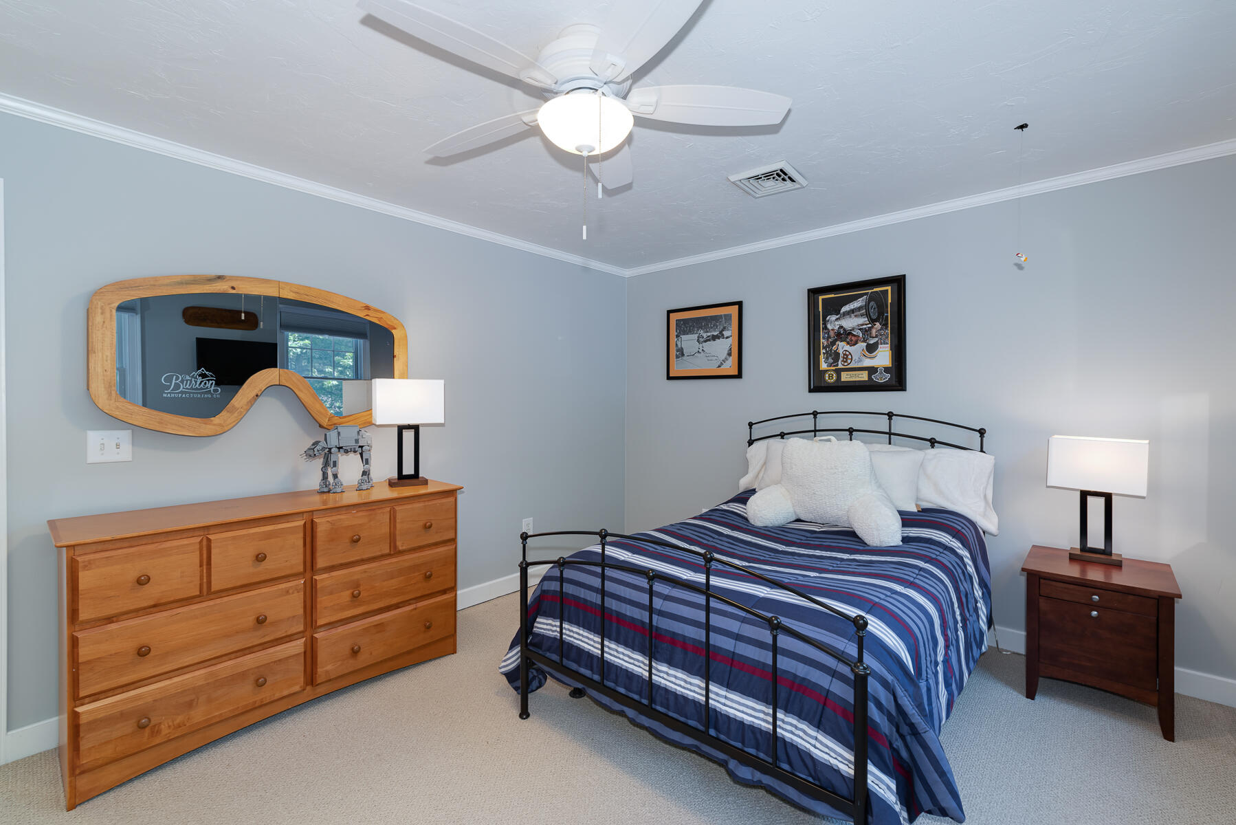 106 Scraggy Neck Road Cataumet, MA 02534 - Photo 26 of 43 a bedroom with a bed and a dresser in it