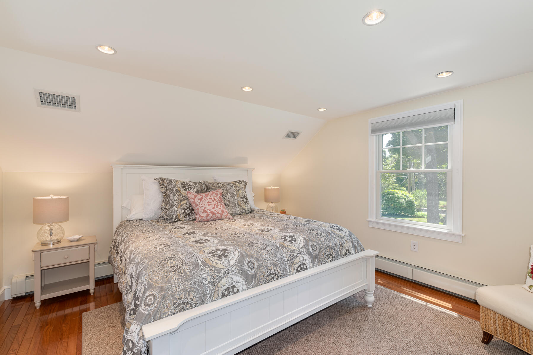 106 Scraggy Neck Road Cataumet, MA 02534 - Photo 27 of 43 a bedroom with a large bed and a window