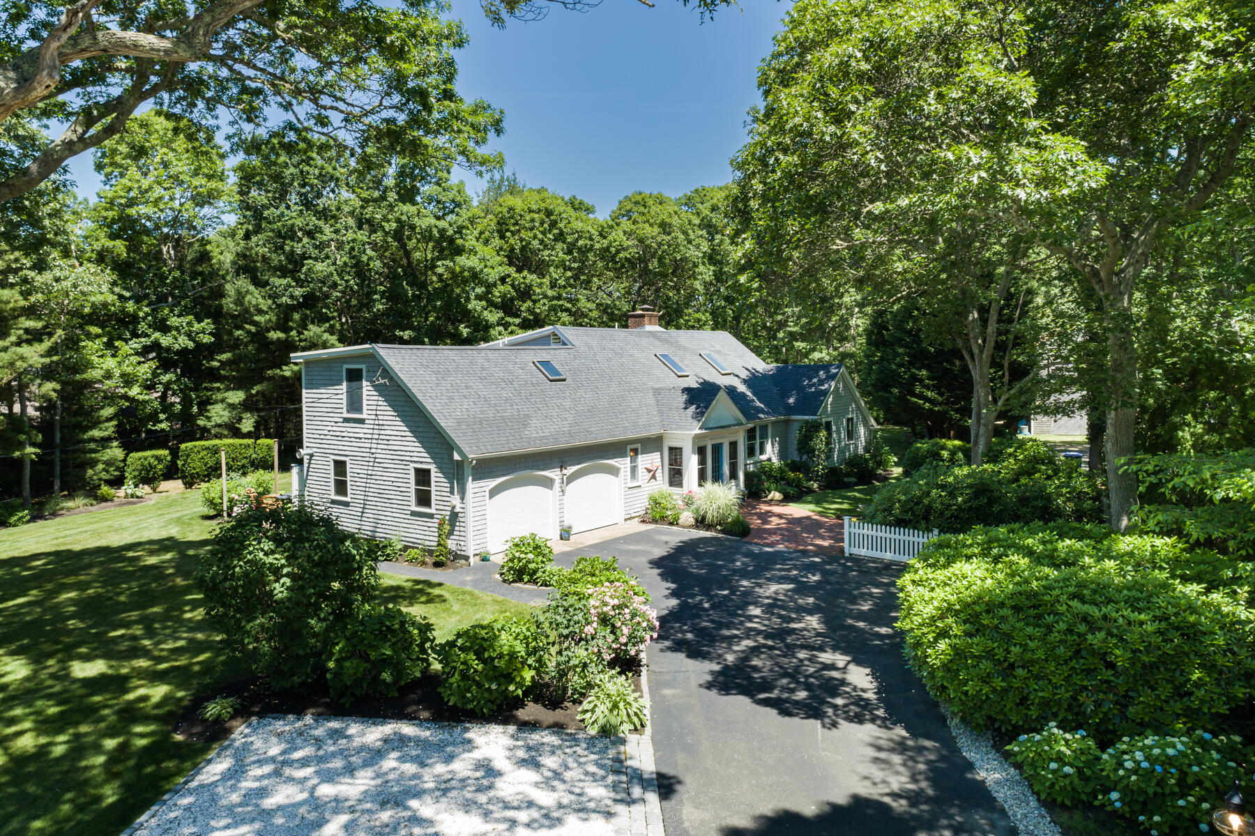 106 Scraggy Neck Road Cataumet, MA 02534 - Photo 30 of 43 a house view with a garden space