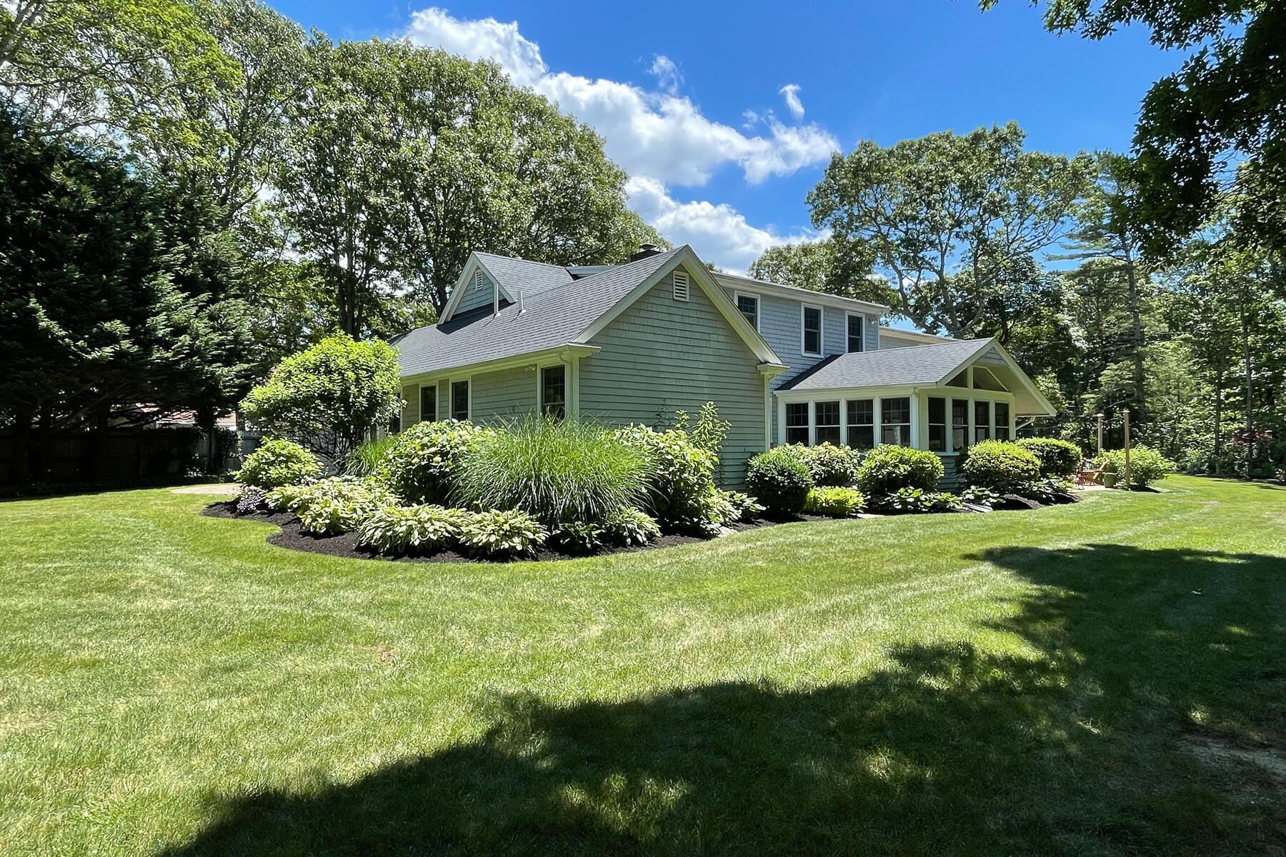 106 Scraggy Neck Road Cataumet, MA 02534 - Photo 31 of 43 a front view of a house with a yard
