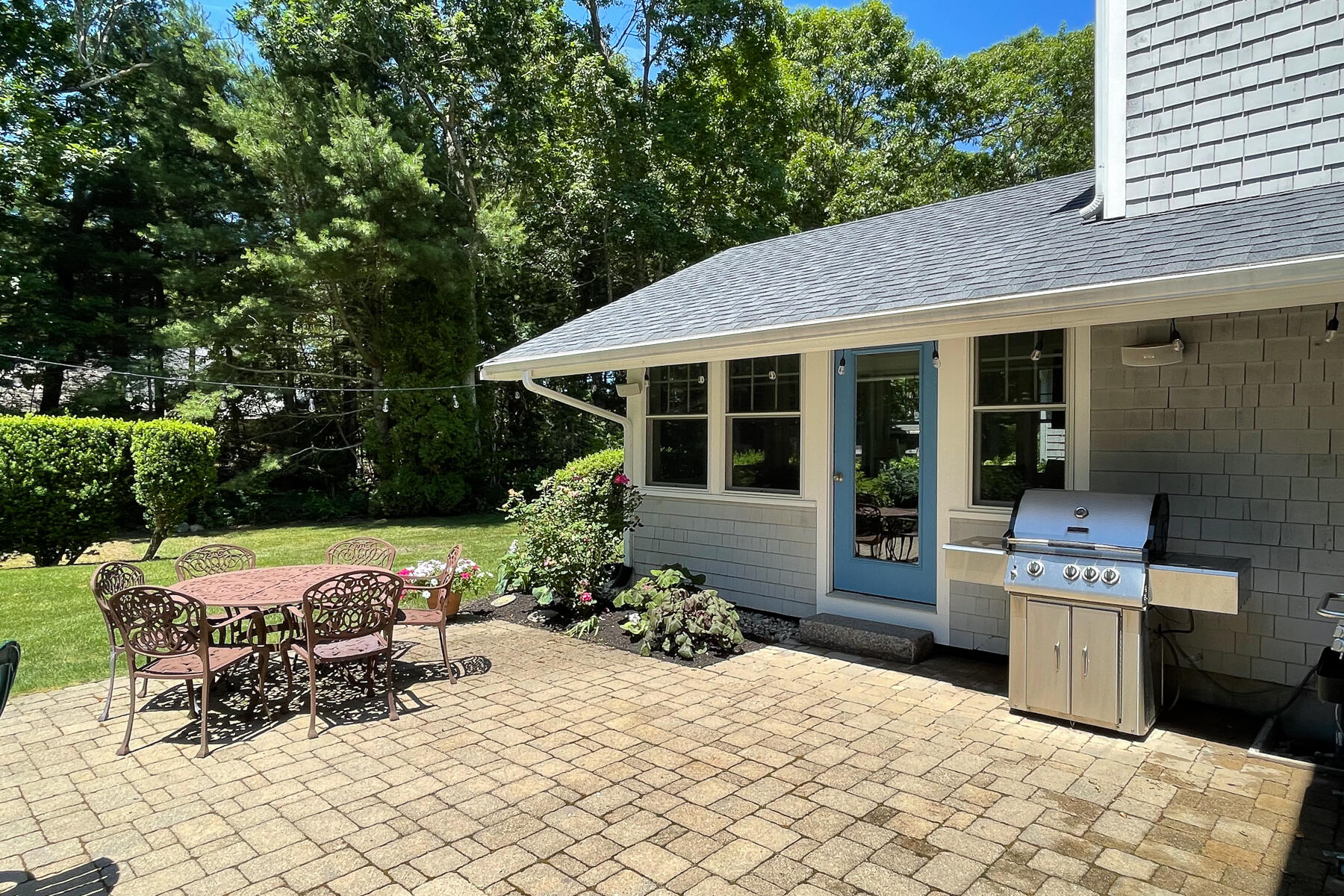 106 Scraggy Neck Road Cataumet, MA 02534 - Photo 34 of 43 a outdoor space with a table and chairs