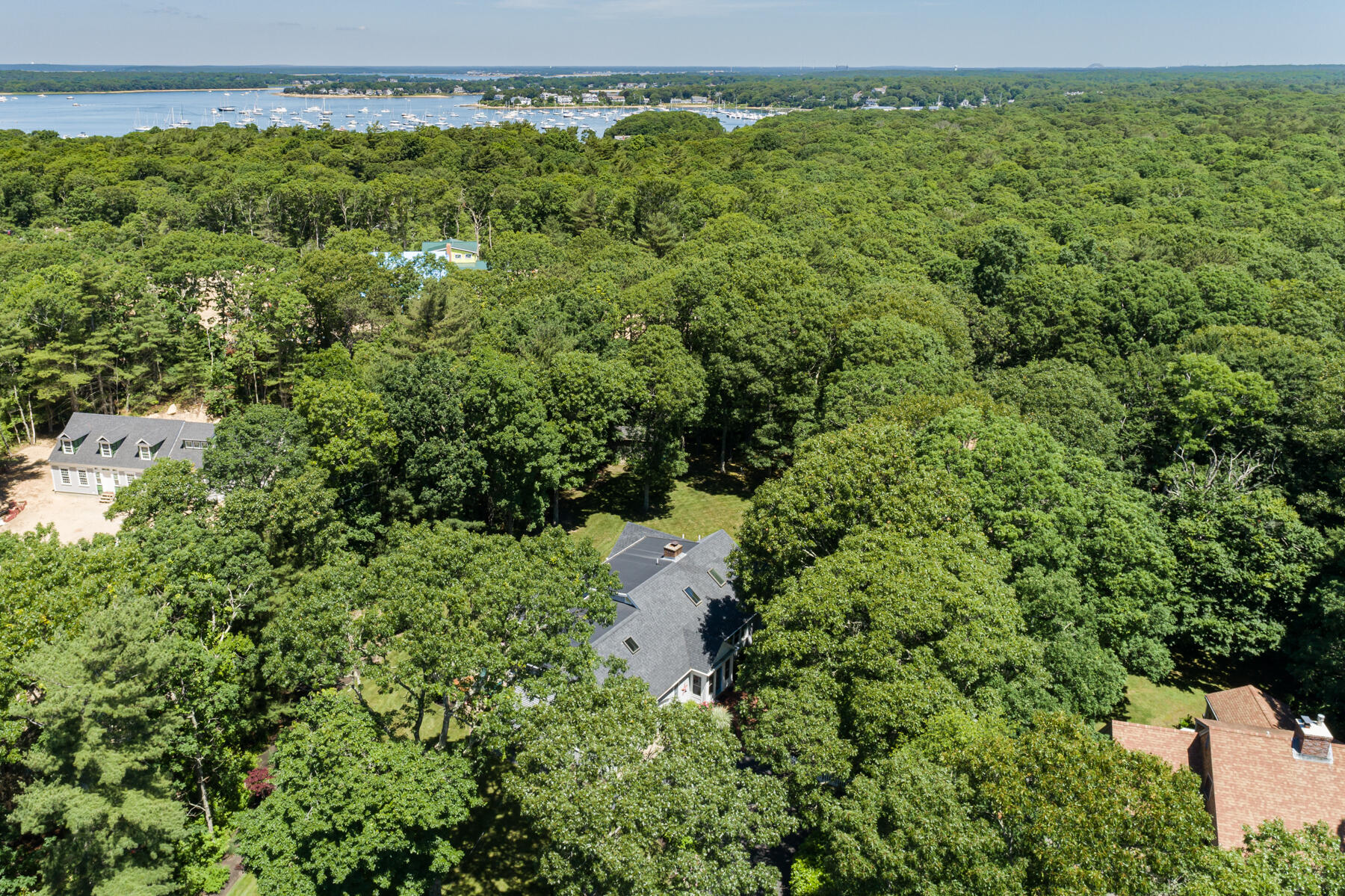 106 Scraggy Neck Road Cataumet, MA 02534 - Photo 37 of 43 an aerial view of residential houses with outdoor space and trees