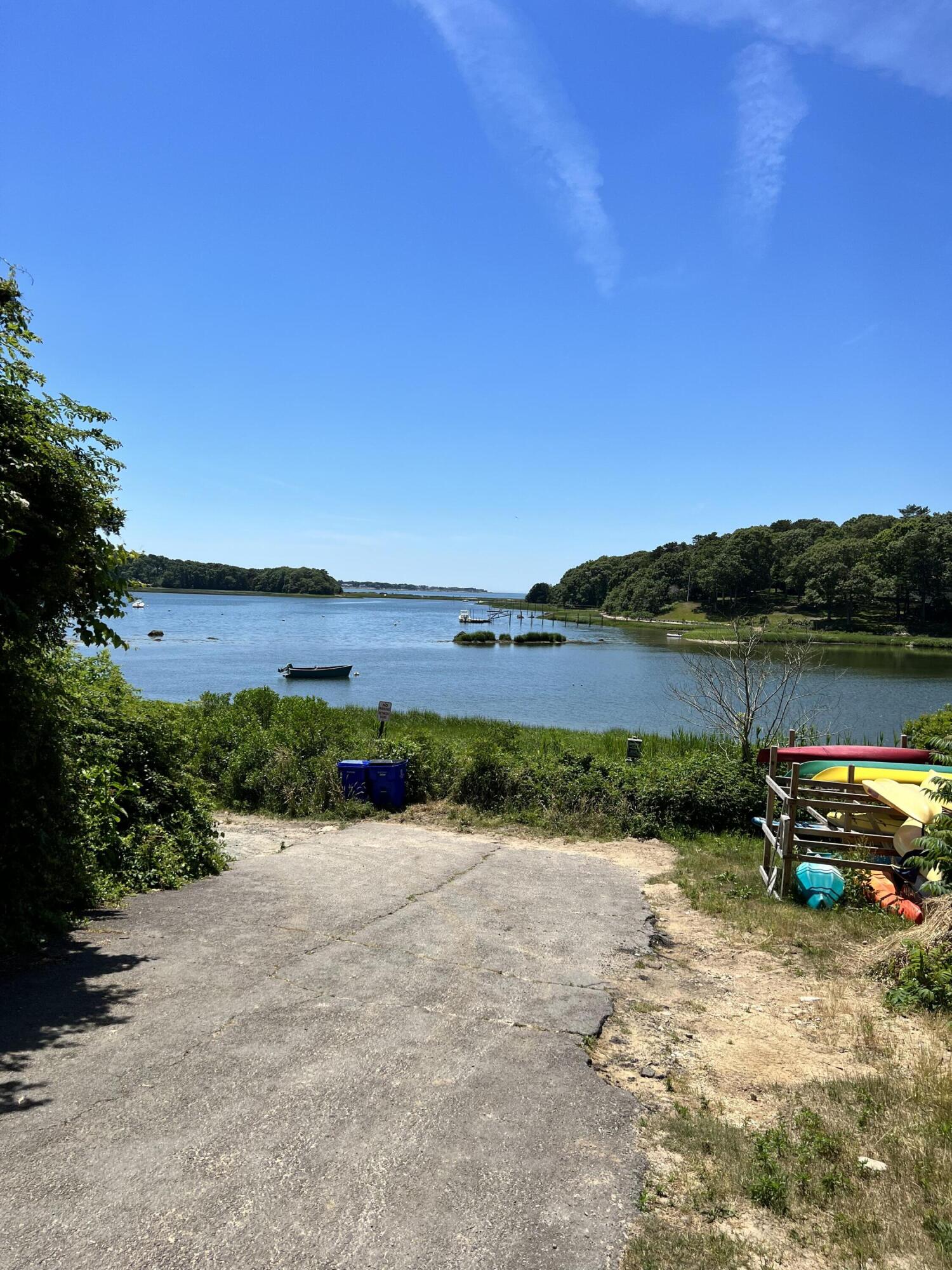 106 Scraggy Neck Road Cataumet, MA 02534 - Photo 39 of 43 a view of a lake with houses in the back