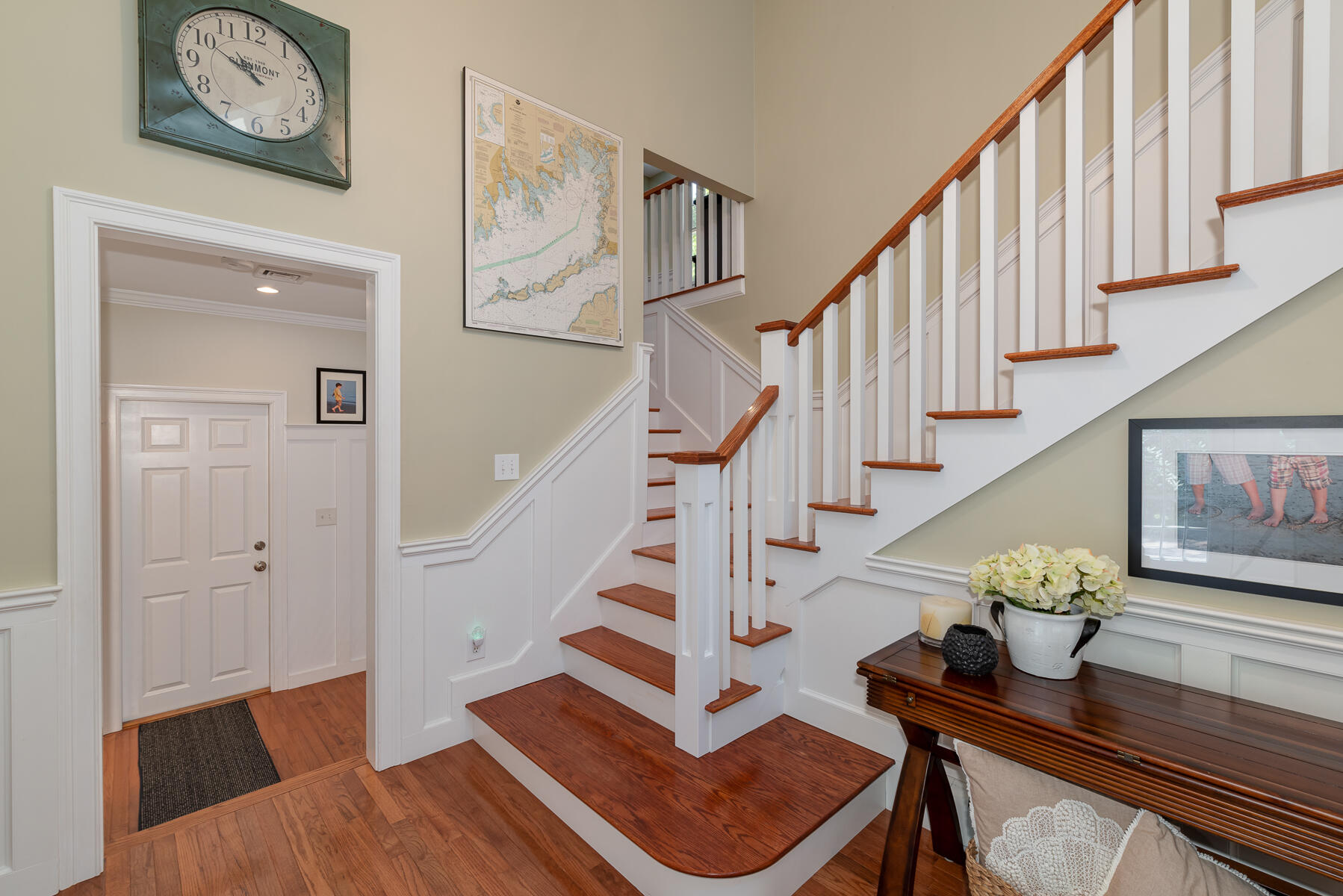 106 Scraggy Neck Road Cataumet, MA 02534 - Photo 7 of 43 a living room with wooden floor and stairs