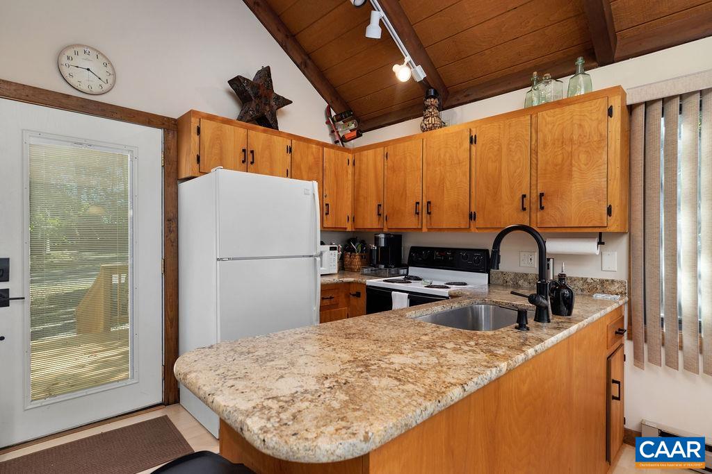 15 Shagbark Lane Roseland, VA 22967 - Photo 12 of 41 a kitchen with stainless steel appliances granite countertop a sink refrigerator and cabinets
