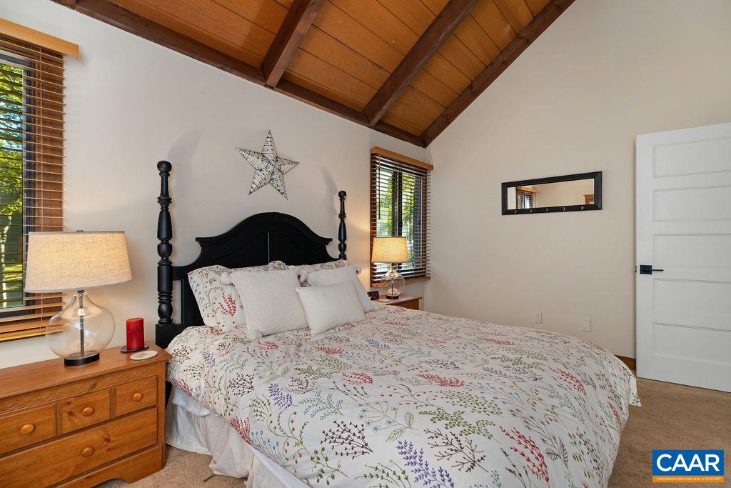 15 Shagbark Lane Roseland, VA 22967 - Photo 27 of 41 a bedroom with a bed and a lamp on dresser