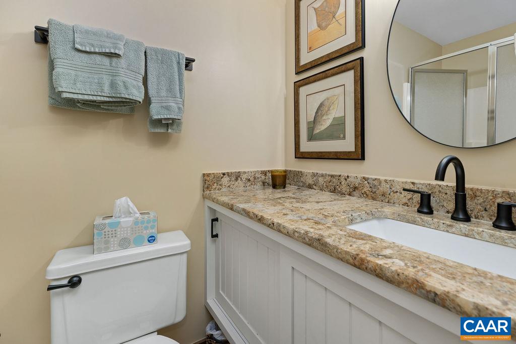 15 Shagbark Lane Roseland, VA 22967 - Photo 29 of 41 a bathroom with a granite countertop sink and a mirror