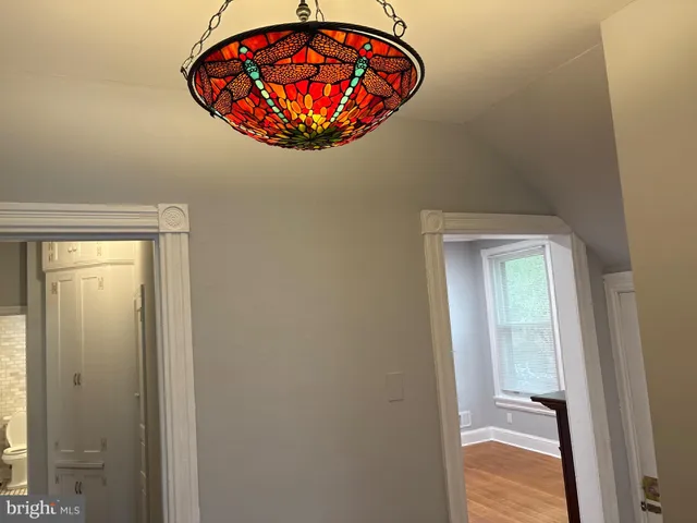 an ocean view with a painting on the wall