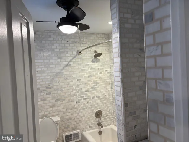 a bathroom with a sink and shower
