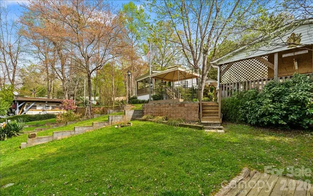 a view of park with large trees