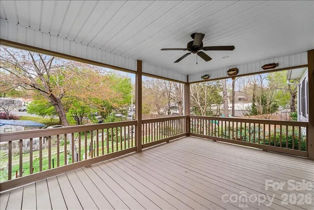 a view of a balcony with wooden floor