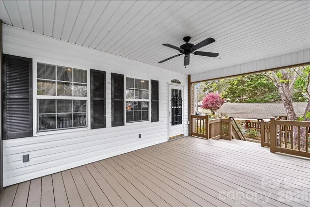 a view of a house with wooden floor and outdoor space