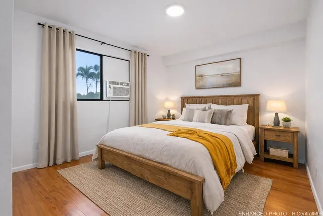 a bedroom with a bed and night stand