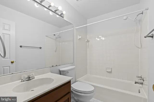 a bathroom with a sink toilet tub and shower