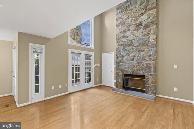 a view of empty room with a fireplace