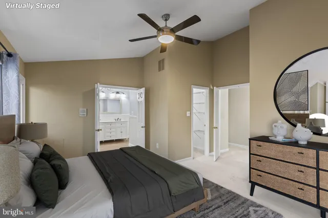 a bedroom with a bed and a mirror