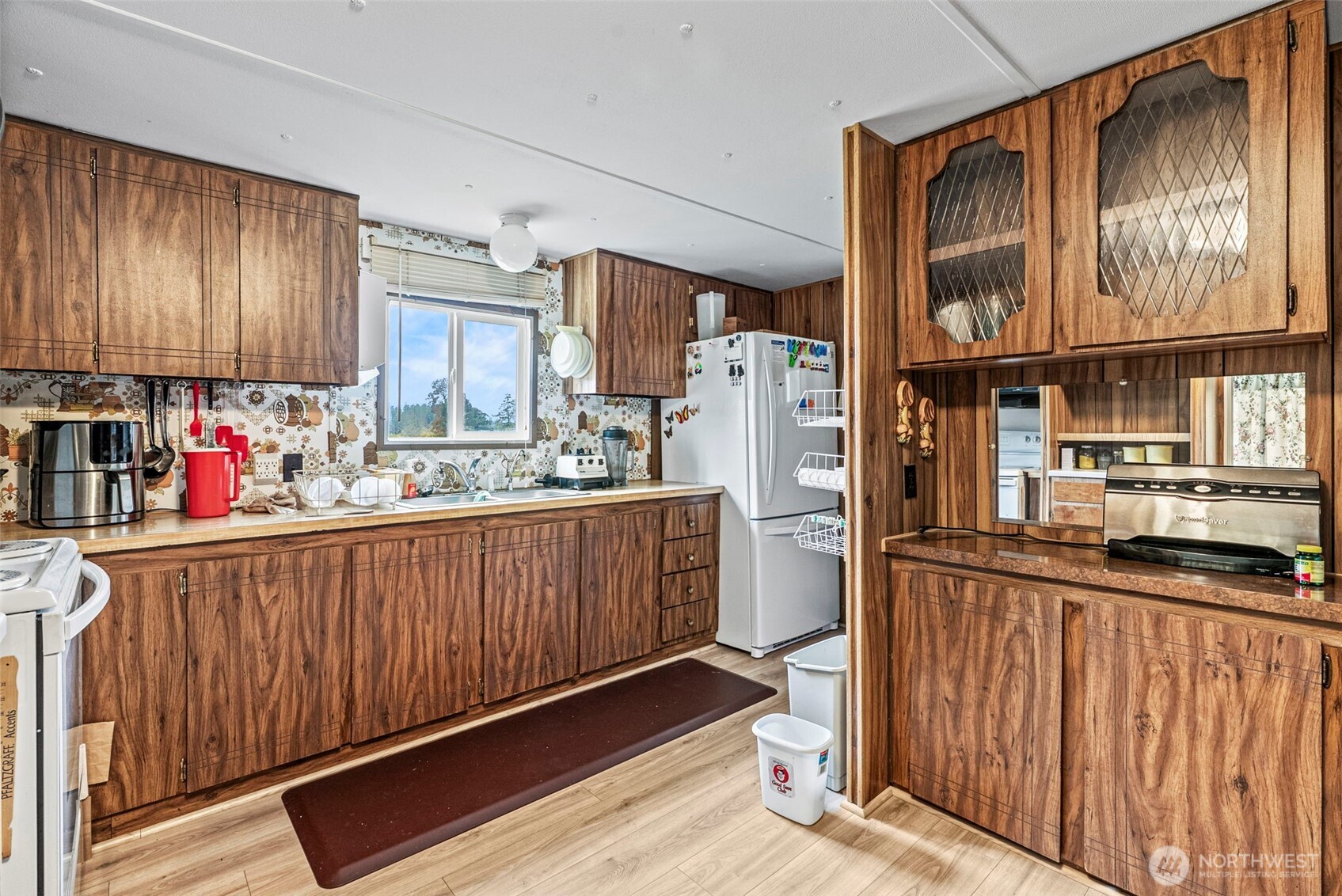 301 Henriot Road Toledo, WA 98591 - Photo 20 of 31 a kitchen with stainless steel appliances granite countertop a refrigerator a sink dishwasher and wooden cabinets with wooden floor