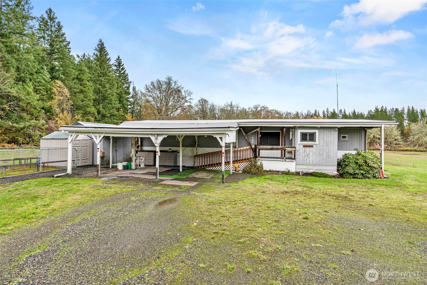 301 Henriot Road Toledo, WA 98591 - Photo 2 of 31 a view of a house with a yard and sitting area