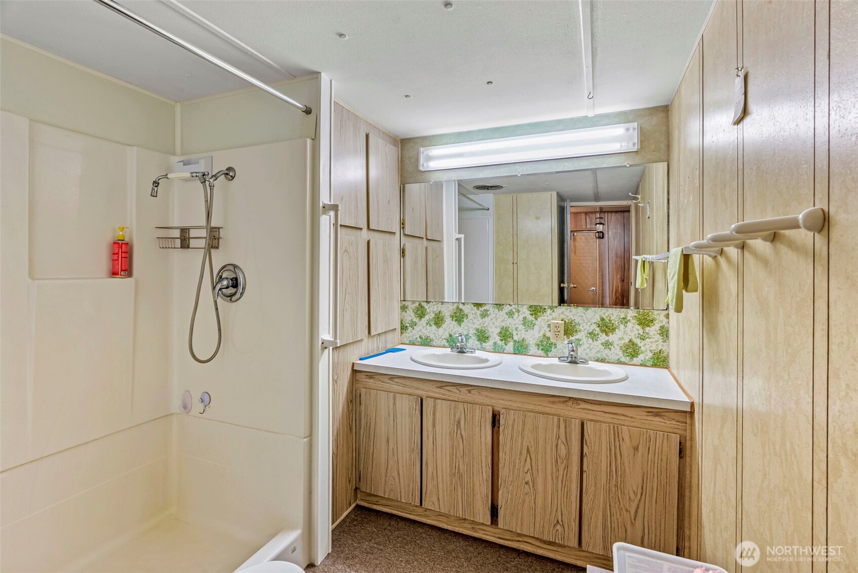 301 Henriot Road Toledo, WA 98591 - Photo 28 of 31 a bathroom with a granite countertop shower a sink and a mirror