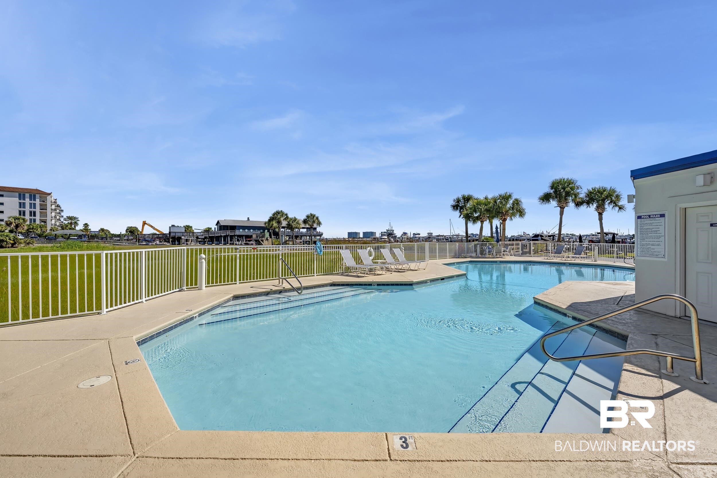 27282 Canal Road, Unit 104 Orange Beach, AL 36561 - Photo 59 of 79 Community pool featuring a patio