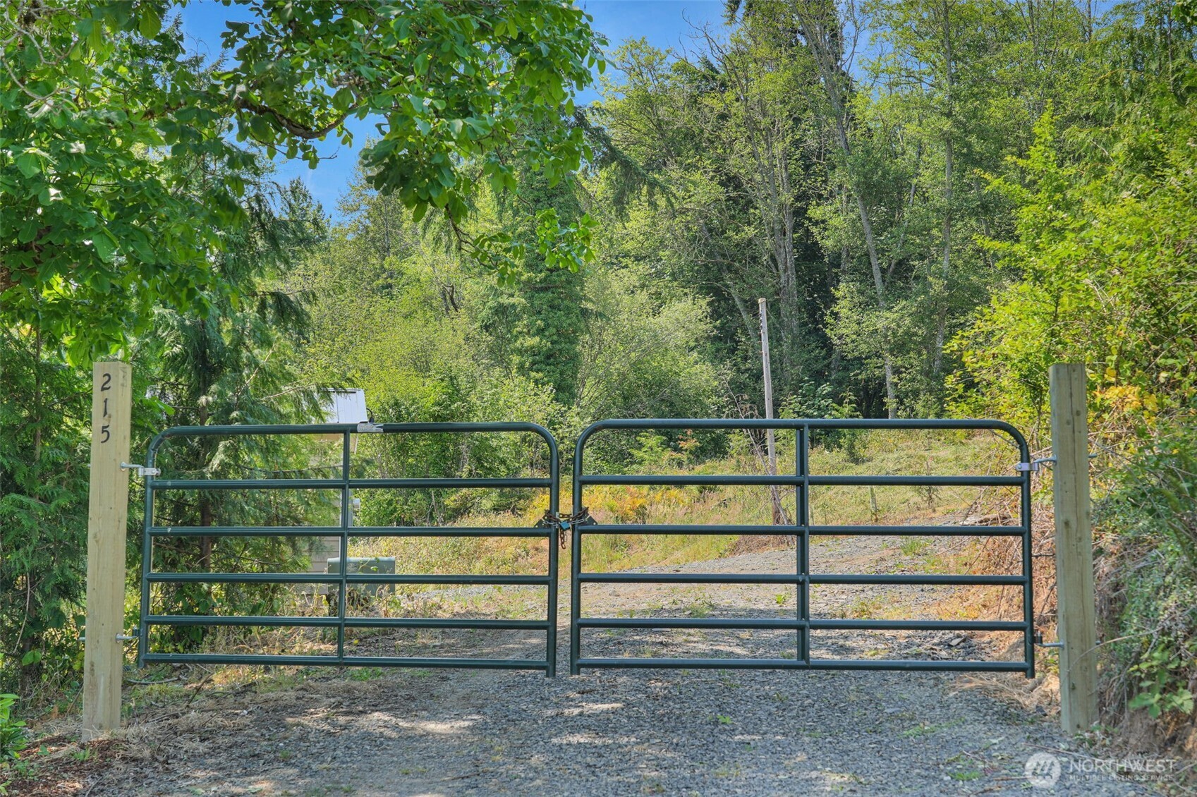 a view of outdoor space with deck and white fence