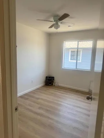 a view of an empty room with a window