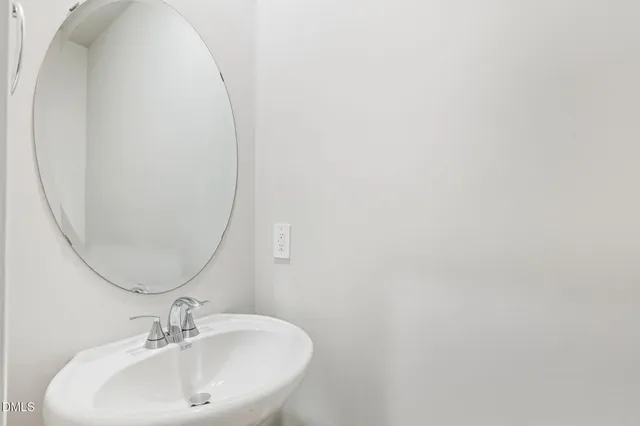 a bathroom with a glass door shower