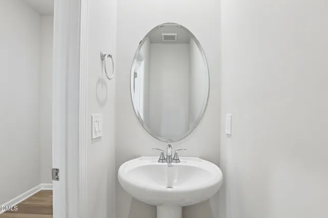 an empty room with a bathroom