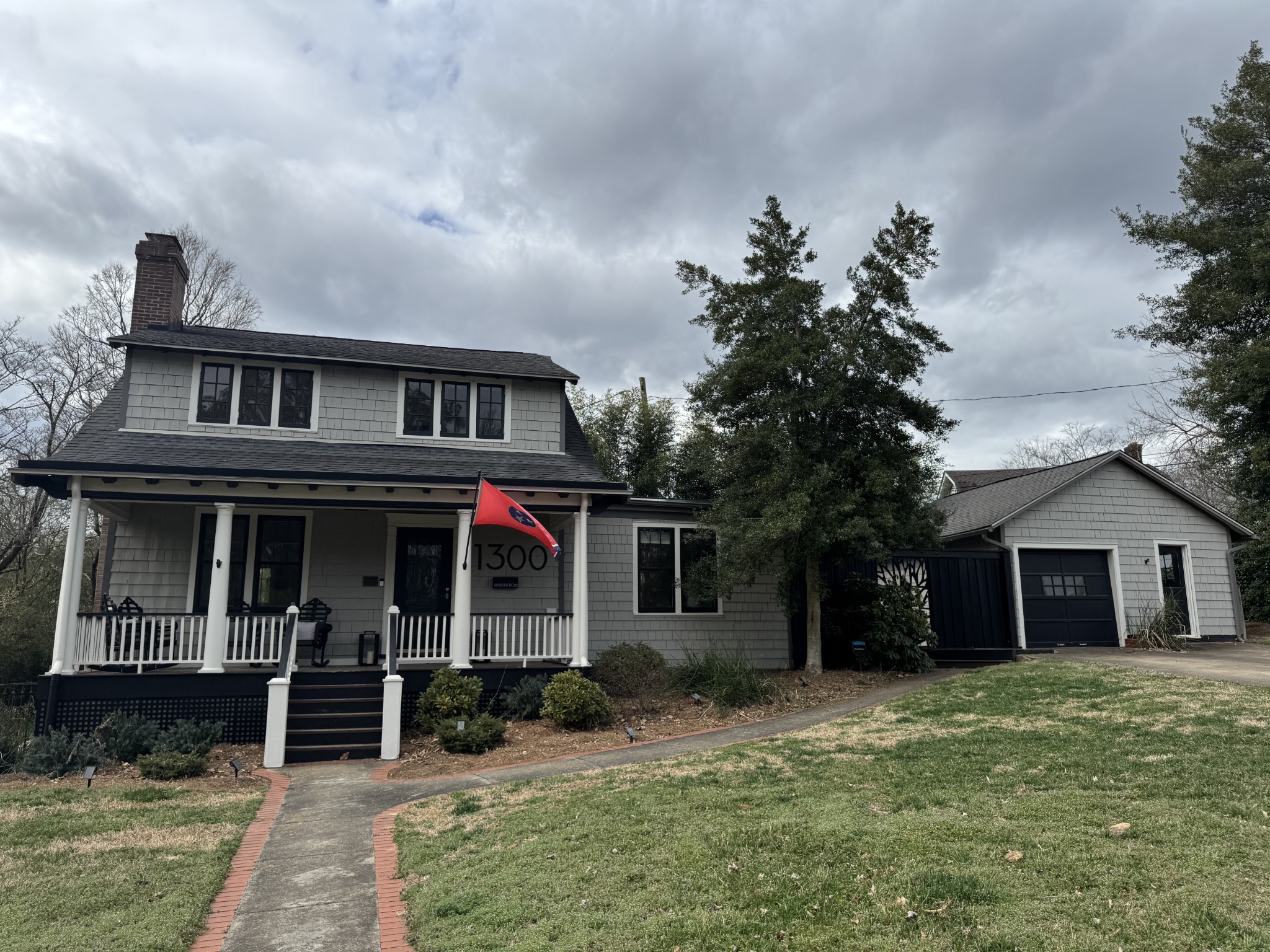 a front view of a house with garden