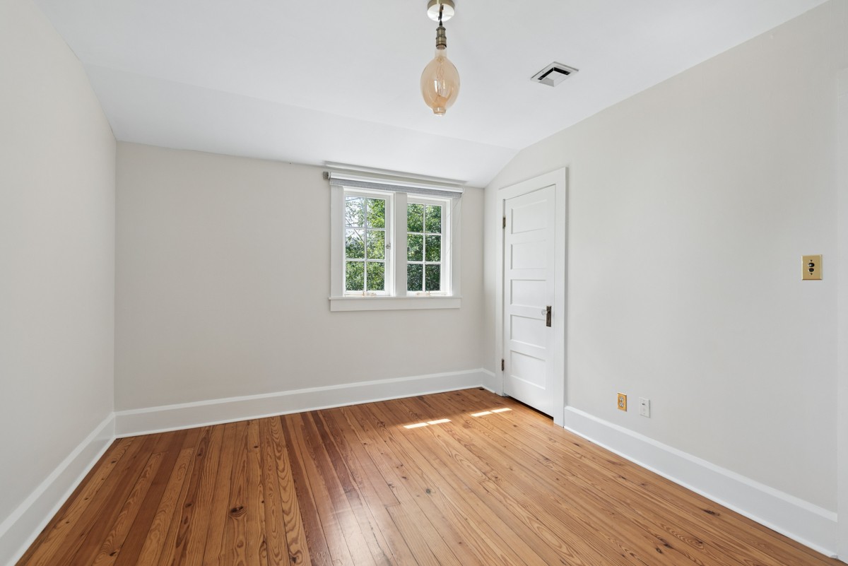 1300 Riverside Road Old Hickory, TN 37138 - Photo 18 of 40 an empty room with wooden floor and windows