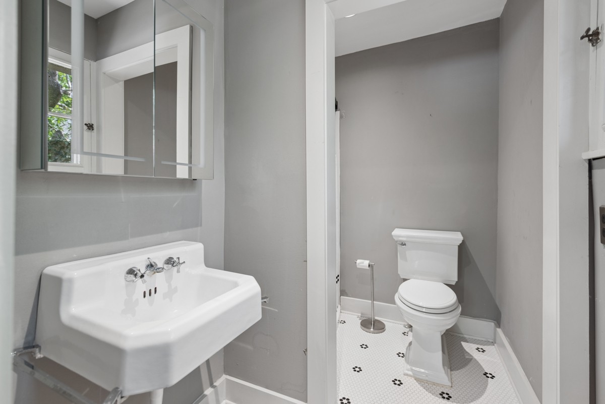1300 Riverside Road Old Hickory, TN 37138 - Photo 34 of 40 a bathroom with a sink a toilet and a mirror