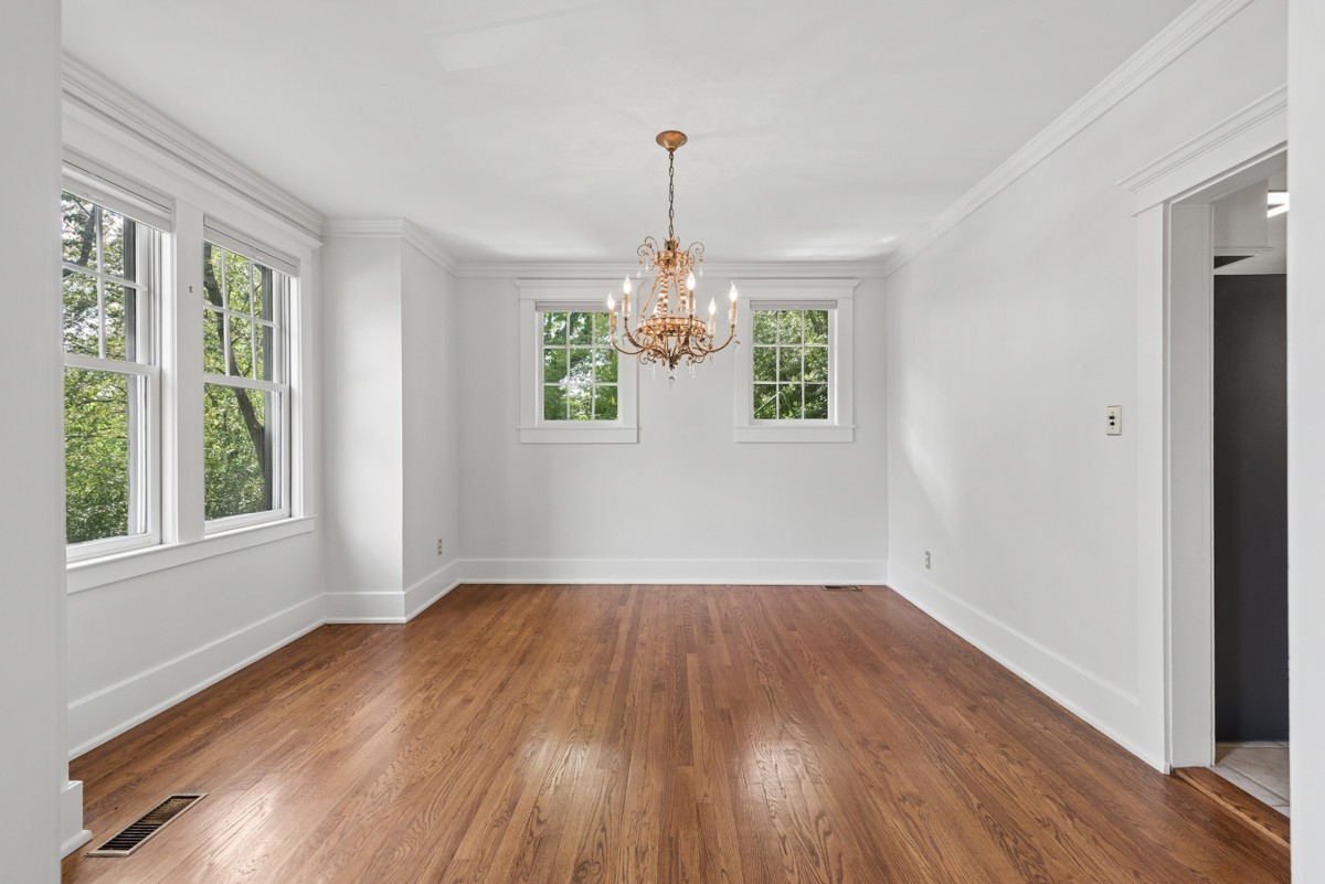 1300 Riverside Road Old Hickory, TN 37138 - Photo 9 of 40 a view of an empty room with wooden floor and a window