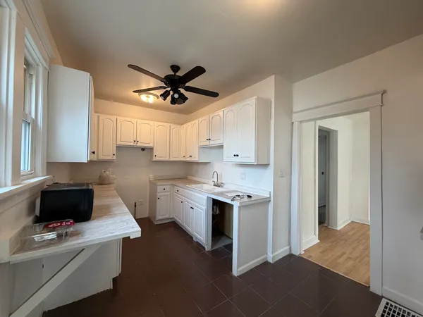 a kitchen with stainless steel appliances a stove a sink and a refrigerator