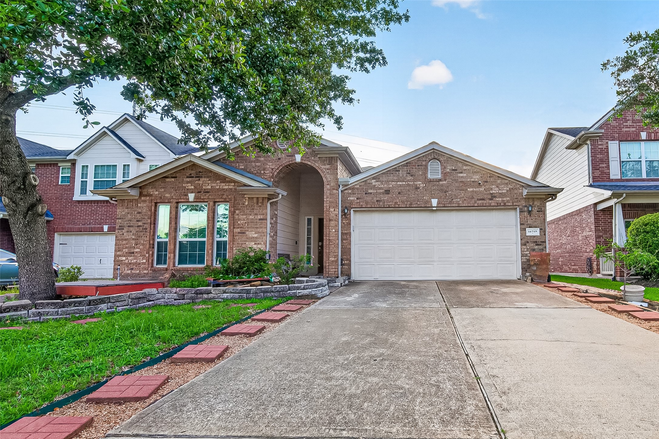 16715 Mackenzie Mesa Drive Spring, TX 77379 - Photo 1 of 50 a front view of a house with a yard and garage