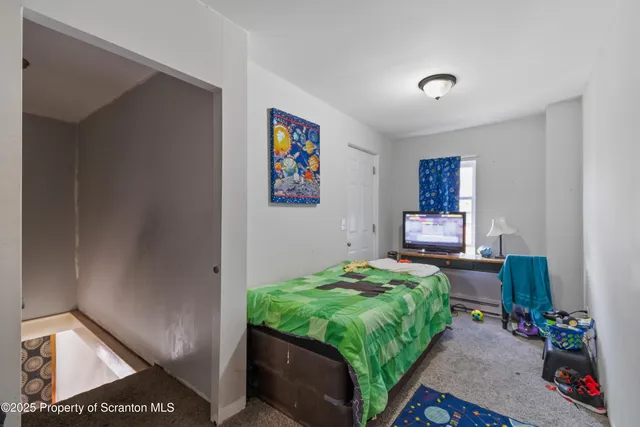 a bedroom with a bed and furniture