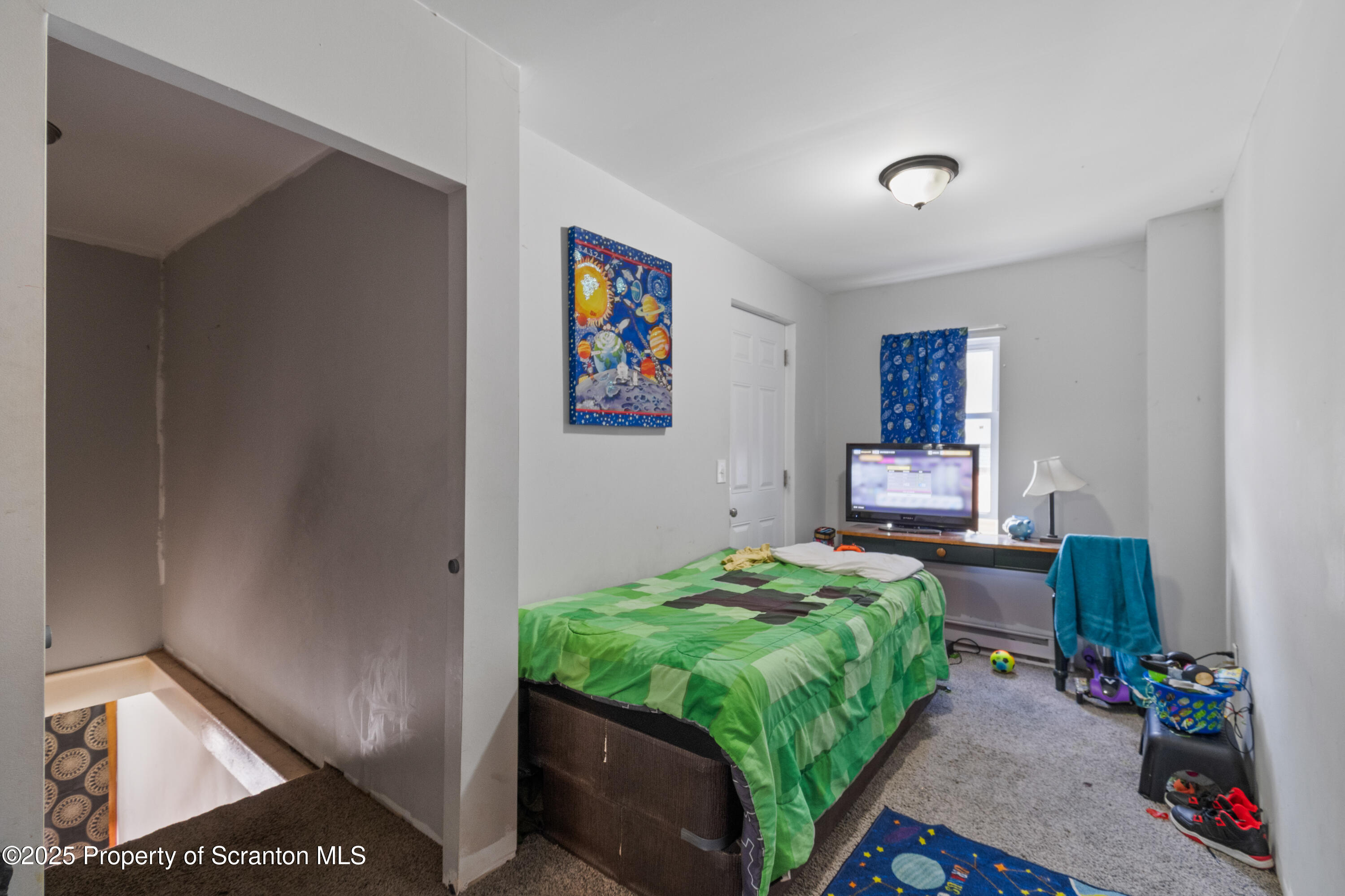 613 East Locust Street Scranton, PA 18505 - Photo 13 of 20 a bedroom with a bed and furniture