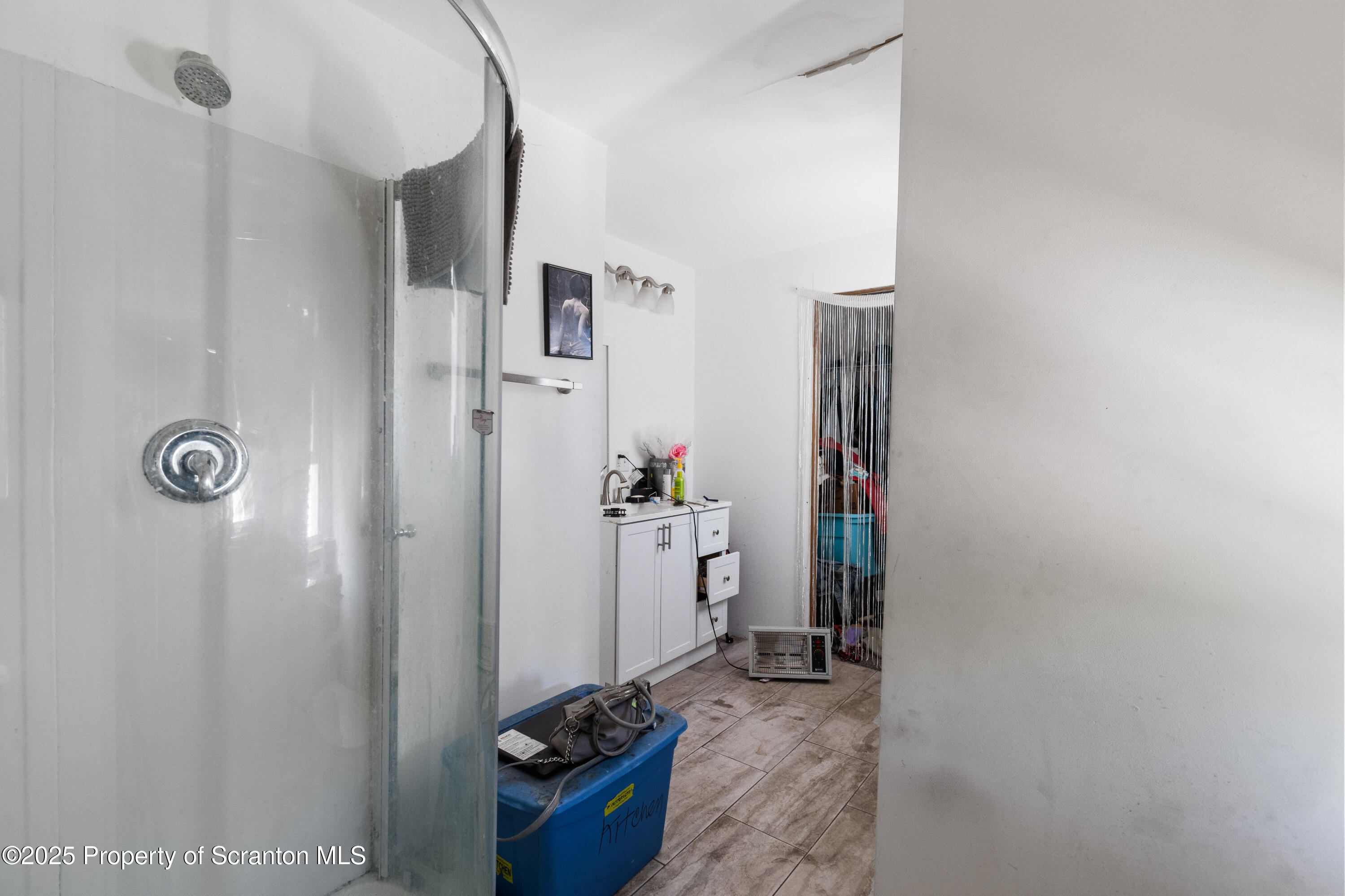 613 East Locust Street Scranton, PA 18505 - Photo 15 of 20 a room with furniture and storage