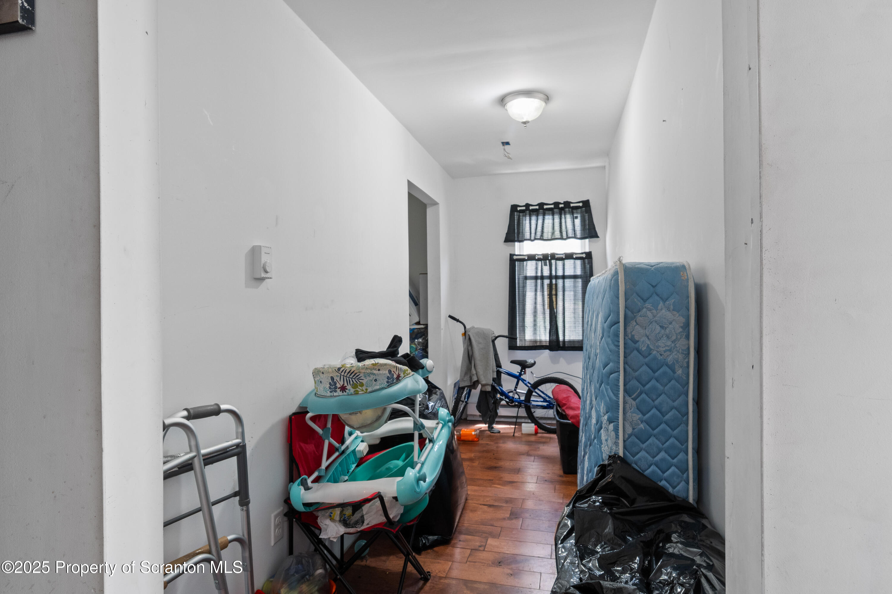613 East Locust Street Scranton, PA 18505 - Photo 18 of 20 a living room with furniture and a book shelf