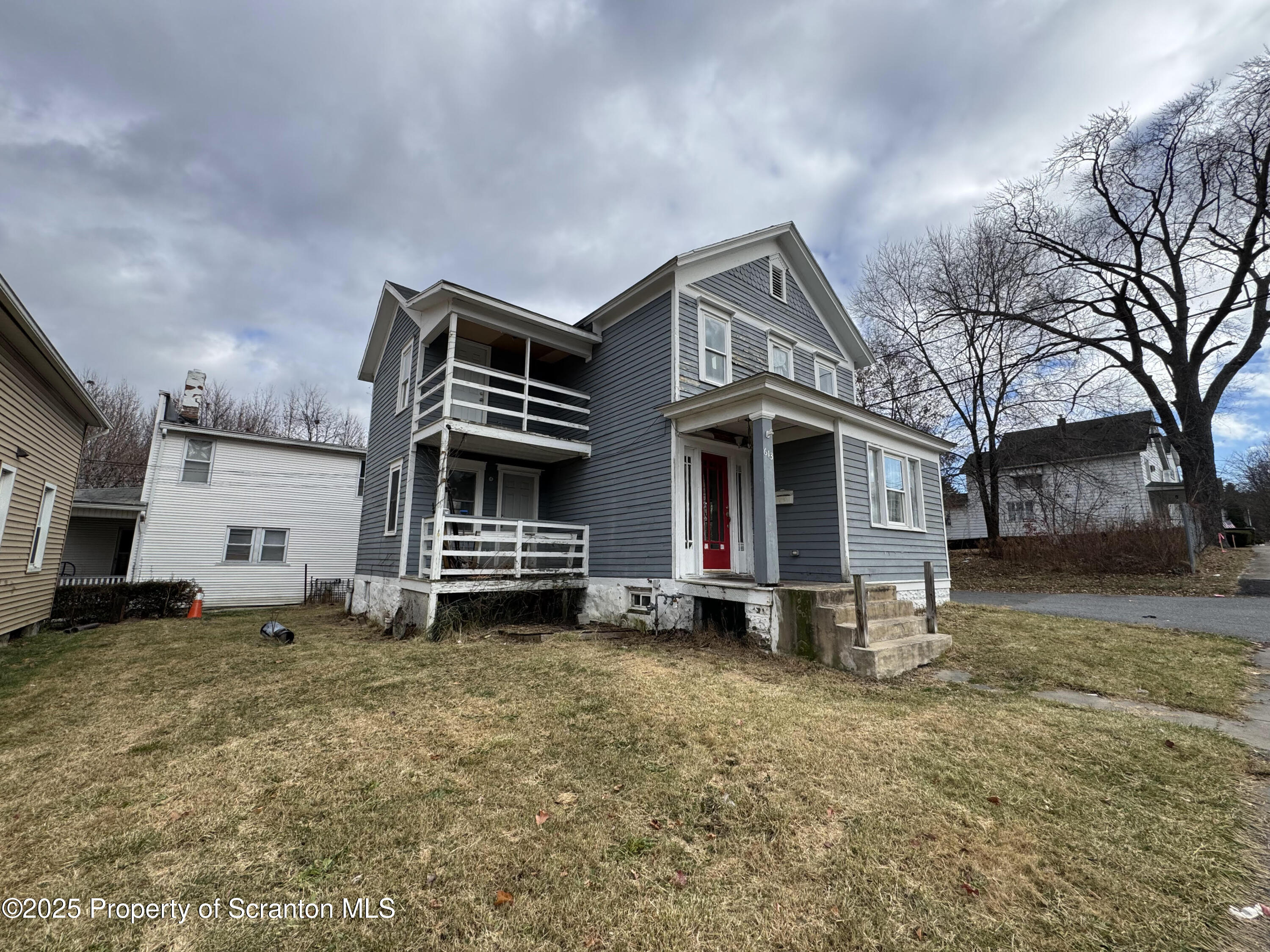 613 East Locust Street Scranton, PA 18505 - Photo 2 of 20 a front view of a house with a yard