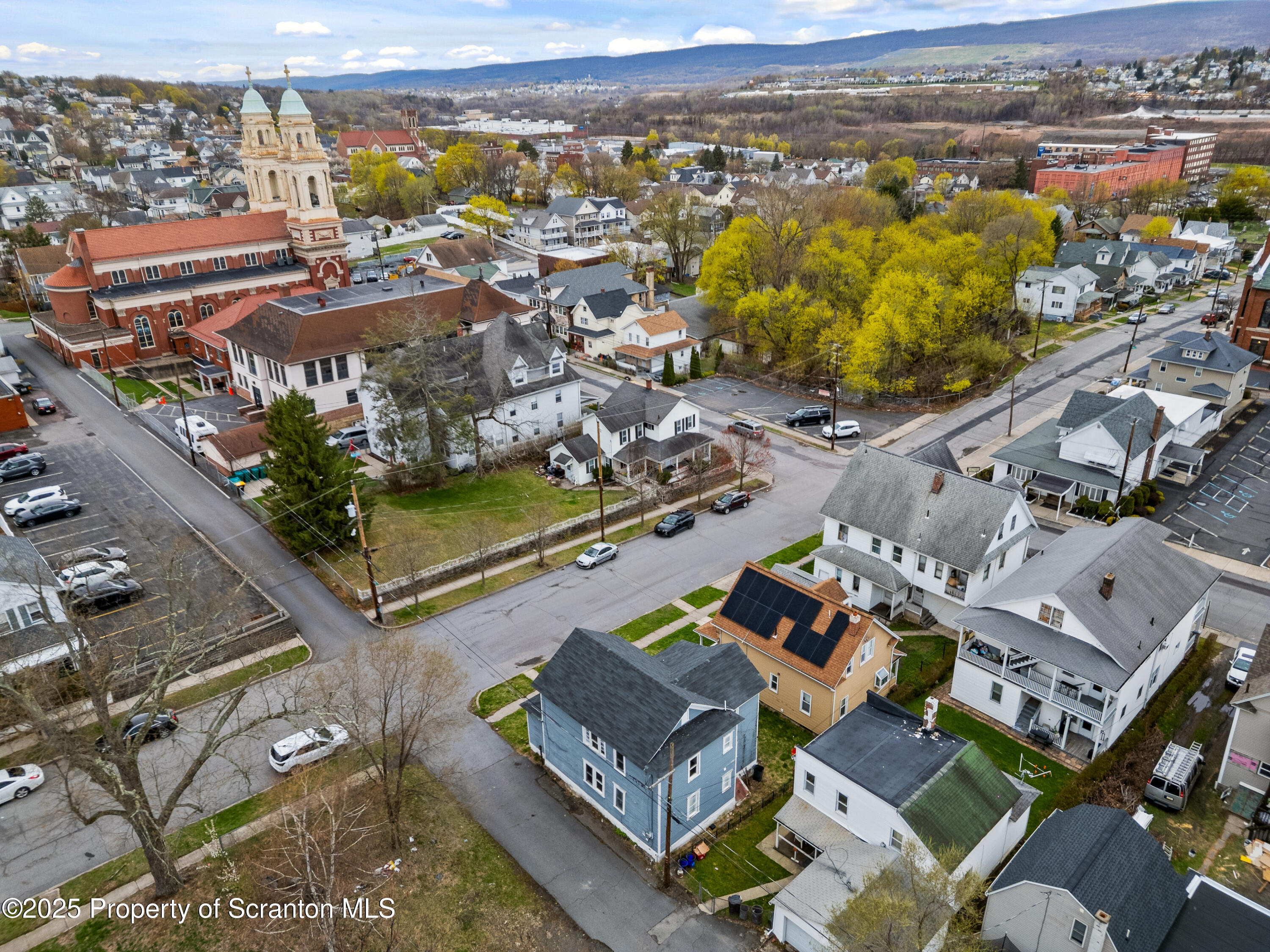 613 East Locust Street Scranton, PA 18505 - Photo 4 of 20 an aerial view of a city with lots of residential buildings and ocean view