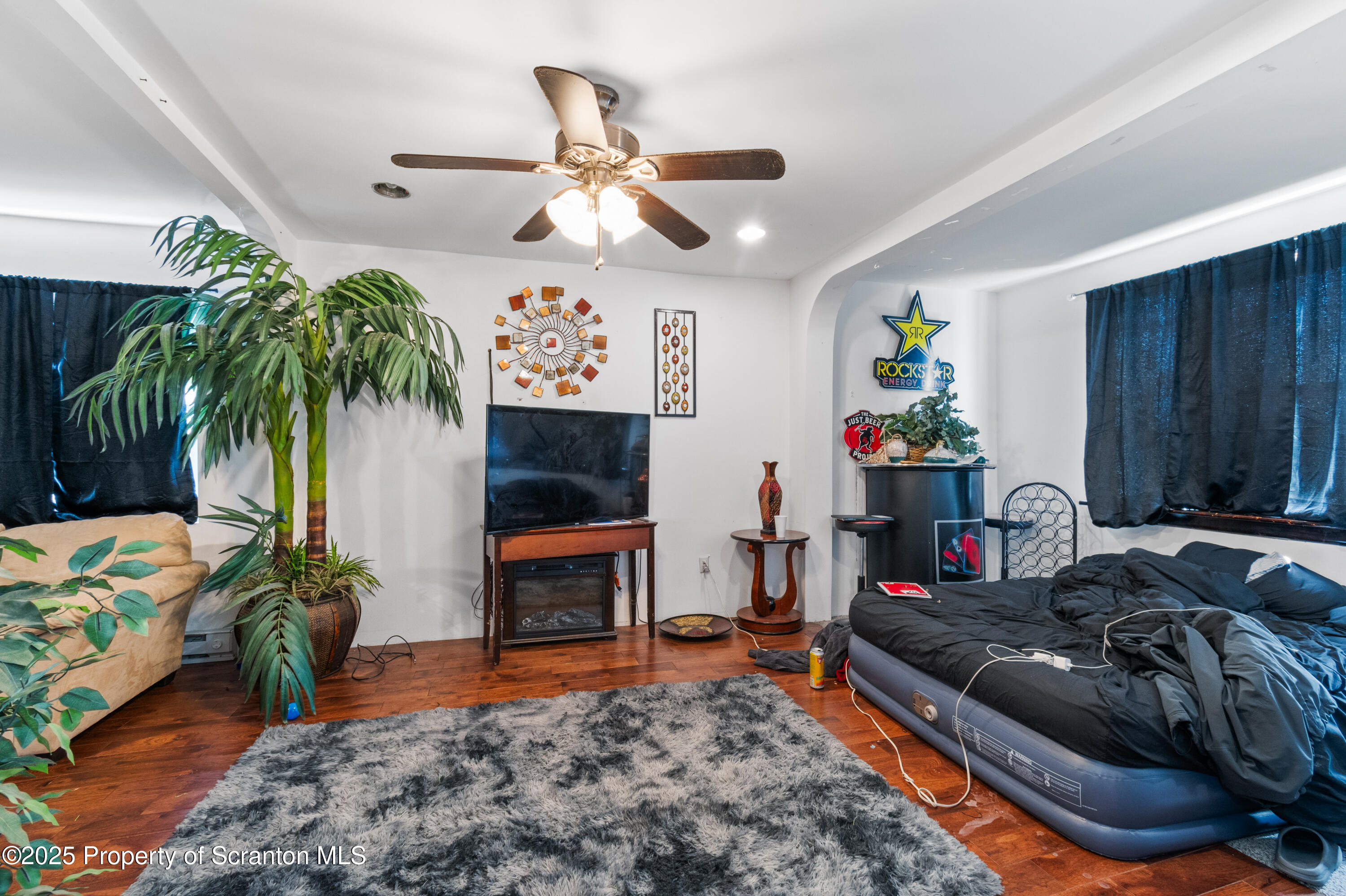 613 East Locust Street Scranton, PA 18505 - Photo 9 of 20 a living room with furniture and a potted plant