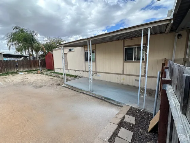 a backyard of a house with seating space
