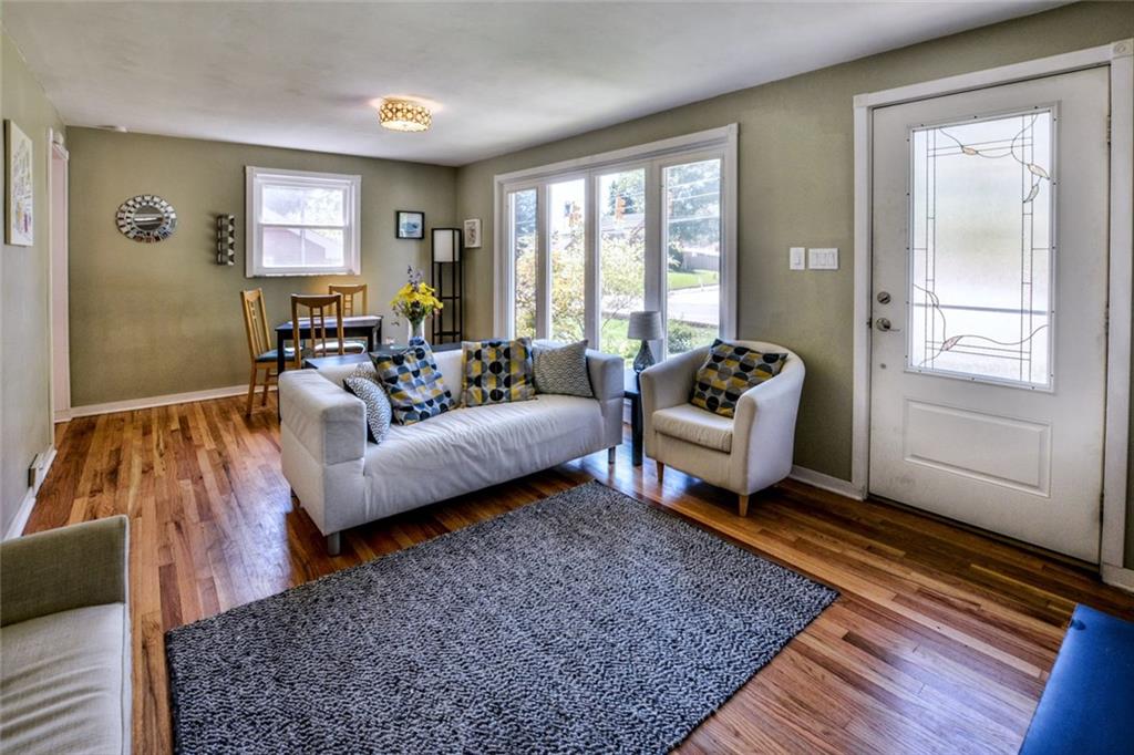 220 Fox Chapel Road Pittsburgh, PA 15238 - Photo 3 of 14 The living room offers floor to ceiling windows that let in plenty of light.